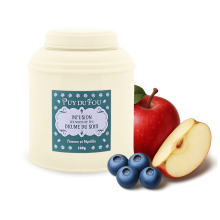 Boîte d'infusion pomme et myrtille Les Noces de Feu - pomme et myrtilles posées à côté de la boîte