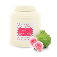 Boîte de thé vert bergamote et rose Le Mime et l'Etoile - avec bergamote et rose posées à côté de la boîte