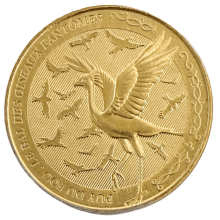 Jeton touristique Puy du Fou Le Bal des Oiseaux Fantômes – face dorée avec grand oiseau aux ailes déployées et ballet de rapaces, frappé par la Monnaie de Paris