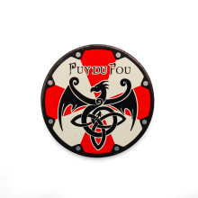 Magnet rond bouclier bicolore viking aux couleurs rouge et beige avec dragon noir et motifs celtiques, logo Puy du Fou