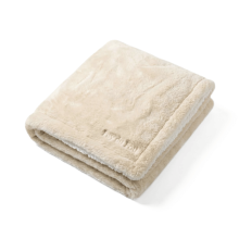 Plaid Puy du Fou – Doublé Effet Mouton beige, présentation pliée mettant en valeur la texture douce et épaisse.