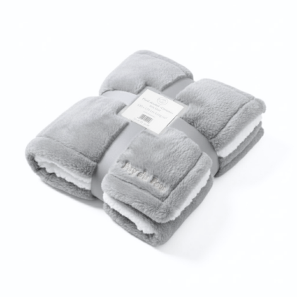 Plaid Puy du Fou – Doublé Effet Mouton gris, présentation pliée mettant en valeur la texture douce et épaisse.