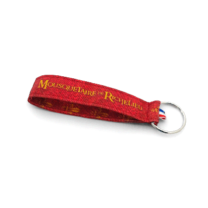 Porte-clés tissu Mousquetaire de Richelieu – revers avec motif fleur de lys doré sur fond rouge et ruban tricolore