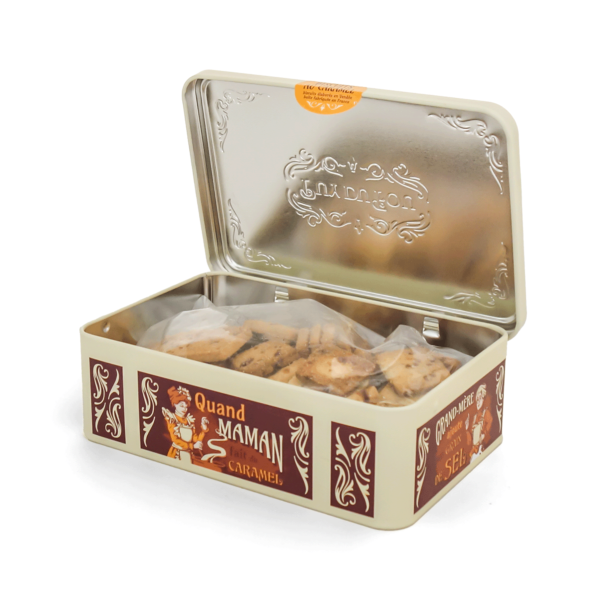 Intérieur boîte métal marron Puy du Fou avec biscuits aux éclats de caramel, inscription 