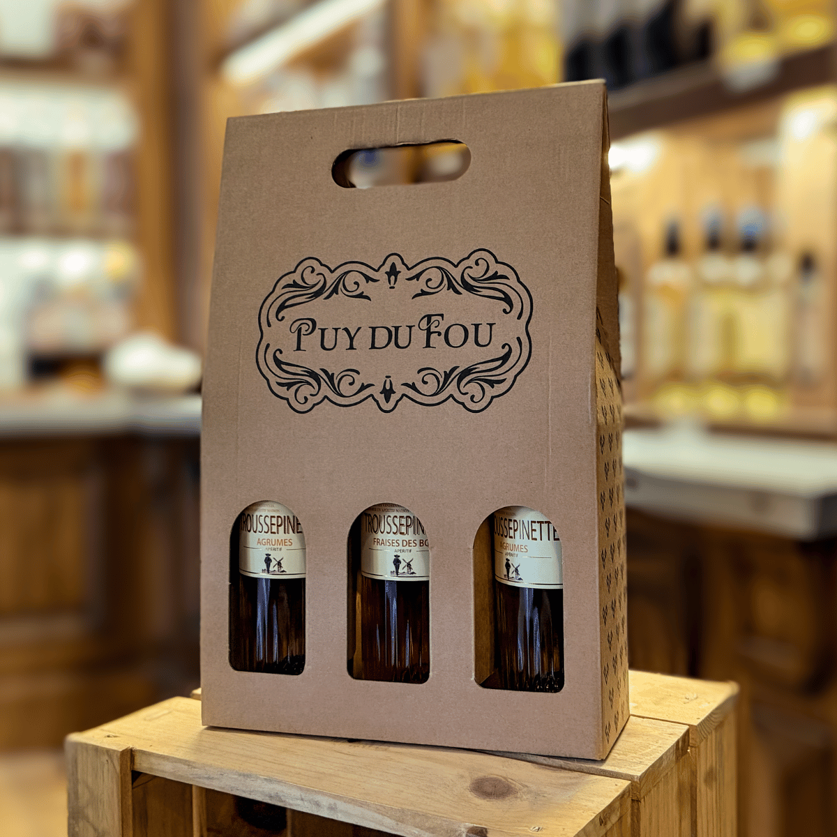 Coffret 3 bouteilles 75cl - avec des bouteilles dedans dans un décor