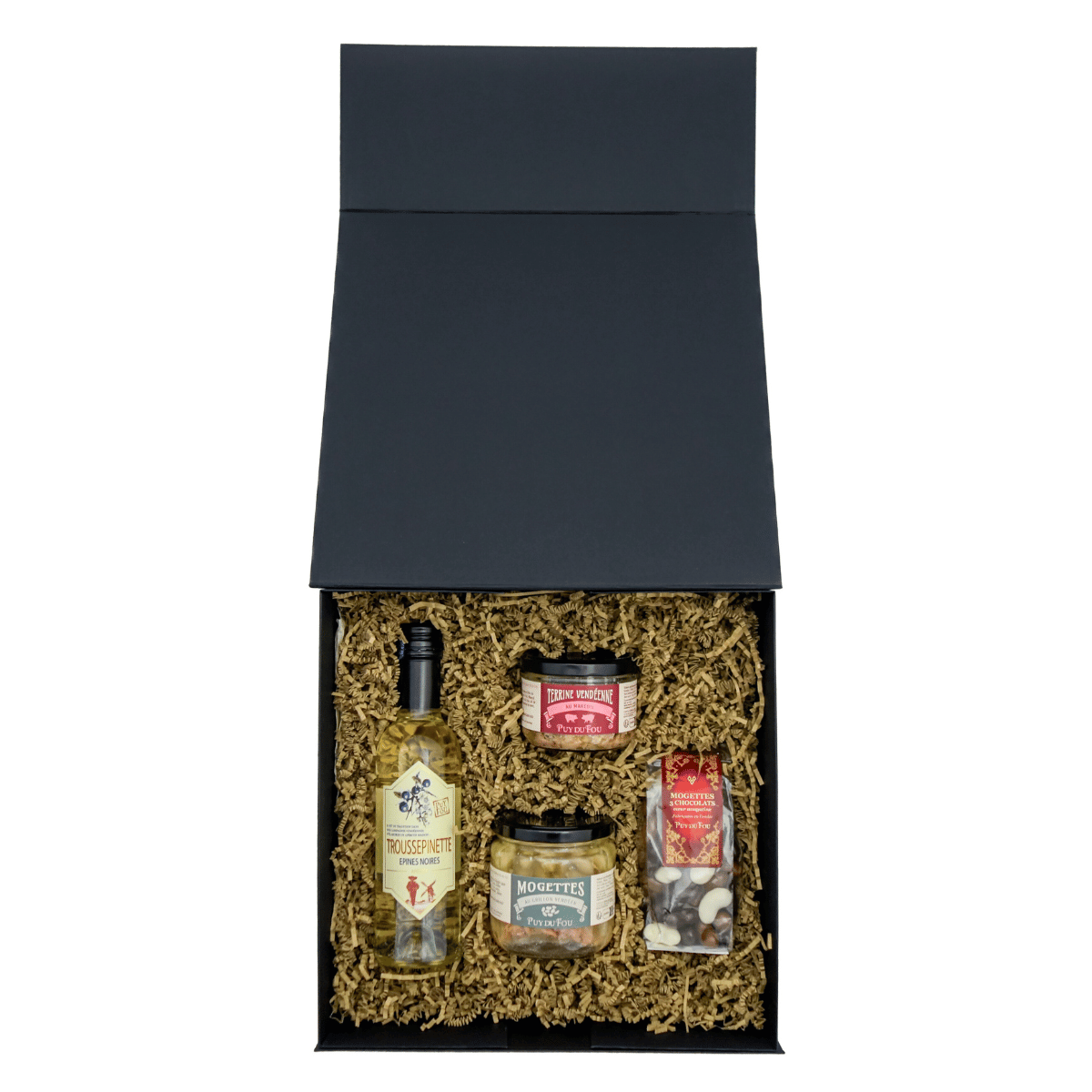 Coffret cadeau spécialités vendéennes ouvert, avec les produits disposés dans la boîte : Troussepinette, mogettes au grillon vendéen, terrine vendéenne au Mareuil et mogettes 3 chocolats.