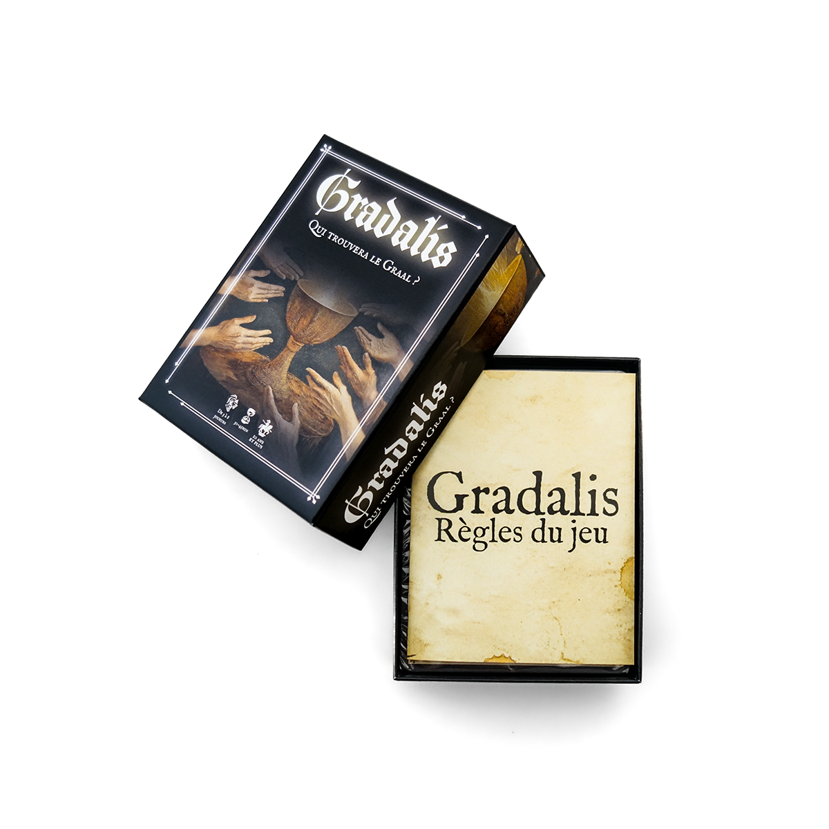 Coffret Gradalis ouvert avec livret de règles du jeu